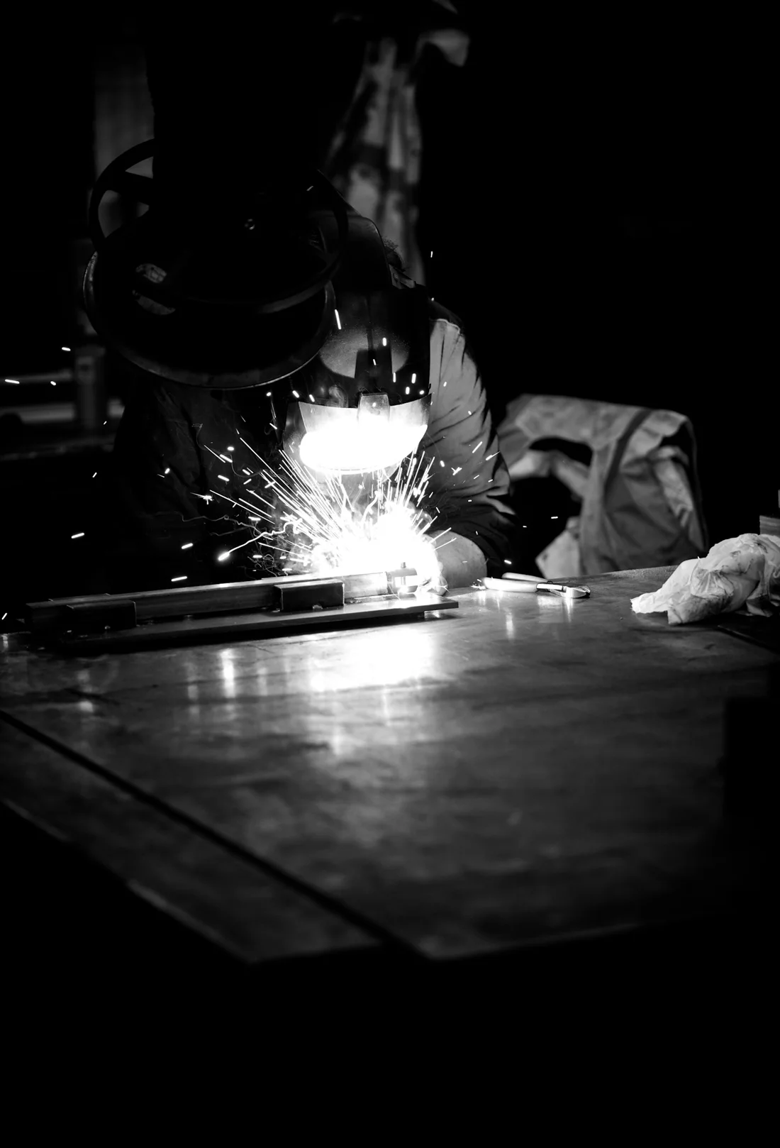 A welder at work, sparks flying